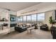 Modern lounge with comfortable seating and stunning city views at 790 N Washington St # 1003, Denver, CO 80203