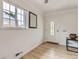 Welcoming entryway features hardwood floors, a white door with decorative glass and ample light at 3610 Olive St, Denver, CO 80207