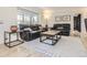 Bright living room with hardwood floors, a comfortable seating area and a large window at 3610 Olive St, Denver, CO 80207