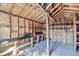 The interior of the shed showcases wooden support beams, shelving, and a concrete floor at 828 S Osceola St, Denver, CO 80219
