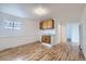 Cozy kitchen area features wood cabinets, sink, and hardwood floors at 828 S Osceola St, Denver, CO 80219