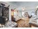 Large living room showcasing a rock fireplace, brick fireplace, and comfortable sofas at 828 S Osceola St, Denver, CO 80219
