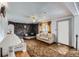Cozy living room with stone fireplace, comfortable seating, and ample natural light at 828 S Osceola St, Denver, CO 80219