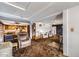 Open-concept living space with kitchen, dining area, and multiple living rooms at 828 S Osceola St, Denver, CO 80219
