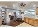 Open-concept living space with kitchen, dining area, and comfortable seating at 828 S Osceola St, Denver, CO 80219