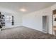 Spacious room with window featuring unique curtains and heater on the wall at 828 S Osceola St, Denver, CO 80219
