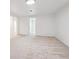 Large basement room features neutral carpet and light walls, with a doorway leading to additional spaces at 1522 Utah St, Golden, CO 80401