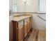 Bathroom with a wood vanity, tiled walls, and modern fixtures at 1522 Utah St, Golden, CO 80401