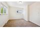 Carpeted bedroom with bright windows at 1522 Utah St, Golden, CO 80401