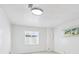 Bright bedroom features neutral walls and carpet, complemented by natural light from two windows with blinds at 1522 Utah St, Golden, CO 80401