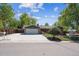 Ranch-style home featuring a spacious driveway and attached two-car garage at 1522 Utah St, Golden, CO 80401