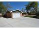 Spacious garage with a wide driveway and partial view of the home at 1522 Utah St, Golden, CO 80401
