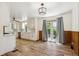 Bright open kitchen with stainless appliances, white cabinets, and door to the back yard at 1522 Utah St, Golden, CO 80401