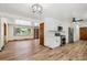 Bright open kitchen featuring wood floors, modern cabinets, stainless appliances, and modern lighting at 1522 Utah St, Golden, CO 80401