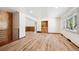 Spacious living room with wood floors, built-in shelves, and natural light at 1522 Utah St, Golden, CO 80401
