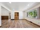Bright living room with wood floors, built-in storage, and large windows at 1522 Utah St, Golden, CO 80401