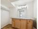 Bathroom vanity with wood cabinets, marble countertop, and a large mirror, providing ample storage and style at 1522 Utah St, Golden, CO 80401