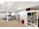 Finished basement with ample seating, storage, and neutral carpet offers flexible living space at 4406 S Delaware St, Englewood, CO 80110
