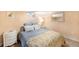 Cozy bedroom features a comfortable bed with a colorful quilt and soft lighting at 4406 S Delaware St, Englewood, CO 80110