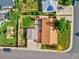 Overhead view of a home with a spacious backyard, featuring a deck, a play area, and mature landscaping at 701 Tucson, Aurora, CO 80011