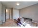 This bedroom offers hardwood floors, a closet, and a window with natural light at 701 Tucson, Aurora, CO 80011