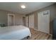 This main bedroom has hardwood floors, two entry doors, and double closets at 701 Tucson, Aurora, CO 80011