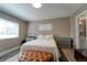 This main bedroom has two large windows, hardwood floors, and light-tone walls at 701 Tucson, Aurora, CO 80011