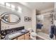 Bathroom featuring stone countertop, modern lighting, a glass enclosed shower, and updated fixtures at 31058 Big Bear Dr, Evergreen, CO 80439