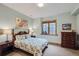 Inviting bedroom with light blue walls, classic wood trim, and comfortable furniture creating a peaceful retreat at 31058 Big Bear Dr, Evergreen, CO 80439