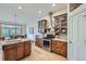 Gourmet kitchen with stainless appliances, hardwood floors, and wooden cabinetry at 31058 Big Bear Dr, Evergreen, CO 80439