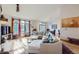 Bright and airy living room with hardwood floors, large windows, and comfortable seating at 31058 Big Bear Dr, Evergreen, CO 80439
