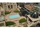 Overhead view of a courtyard with a pool, lounge chairs, manicured lawns, and architectural details at 925 N Lincoln St # 12G, Denver, CO 80203