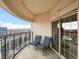 Outdoor balcony with decorative black railing and sliding glass doors overlooking a cityscape at 925 N Lincoln St # 12G, Denver, CO 80203