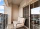 A charming balcony with iron railings and a comfortable cushioned seating area at 925 N Lincoln St # 12G, Denver, CO 80203