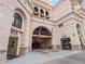 Exterior entrance to a building at 925 with visible parking garage access and an Italian food restaurant at 925 N Lincoln St # 12G, Denver, CO 80203