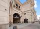 Exterior of building shows restaurant entrance and covered parking at 925 N Lincoln St # 12G, Denver, CO 80203