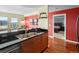 Modern kitchen featuring dark countertops, stainless steel appliances, and hardwood flooring at 925 N Lincoln St # 12G, Denver, CO 80203
