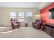 Cozy living room with recliner chairs, soft carpet, and bright windows at 925 N Lincoln St # 12G, Denver, CO 80203