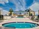 Beautiful rooftop pool area featuring a jacuzzi and a sun deck with lounge chairs at 925 N Lincoln St # 12G, Denver, CO 80203