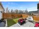Cozy backyard with artificial grass, patio seating, and a hanging egg chair, perfect for relaxing at 5404 W 95Th Pl, Westminster, CO 80020