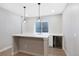 Basement bar with modern finishes, pendant lighting, and a beverage fridge at 5404 W 95Th Pl, Westminster, CO 80020