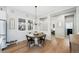 Dining room with a round table, chandelier, and large windows at 5404 W 95Th Pl, Westminster, CO 80020