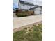 View of backyard, driveway, and home exterior, showcasing its layout and landscaping at 5404 W 95Th Pl, Westminster, CO 80020