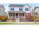 Charming two-story home featuring a welcoming front porch and classic red brick accents at 5404 W 95Th Pl, Westminster, CO 80020