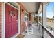 Inviting covered porch with rocking chairs and brick facade at 5404 W 95Th Pl, Westminster, CO 80020