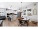Open-concept kitchen featuring an island, stainless steel appliances, and adjacent dining area at 5404 W 95Th Pl, Westminster, CO 80020
