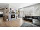Cozy living room featuring a decorative fireplace and stylish decor elements at 5404 W 95Th Pl, Westminster, CO 80020
