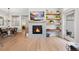 Comfortable and stylish living room with a fireplace and an open floor plan at 5404 W 95Th Pl, Westminster, CO 80020