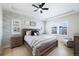 Spacious main bedroom with a brick accent wall and natural light at 5404 W 95Th Pl, Westminster, CO 80020