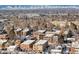 Scenic aerial view of neighborhood homes with a mountain backdrop on a bright day at 148 S Emerson St # 206, Denver, CO 80209